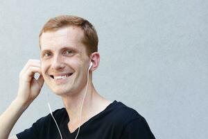 Close up portrait of a redhead of a beautiful manly guy with freckles photo