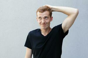 Close up portrait of a redhead of a beautiful manly guy with freckles photo