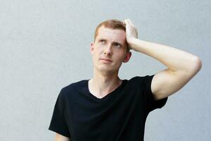 Close up portrait of a redhead of a beautiful manly guy with freckles photo