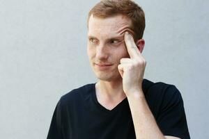 Close up portrait of a redhead of a beautiful manly guy with freckles photo