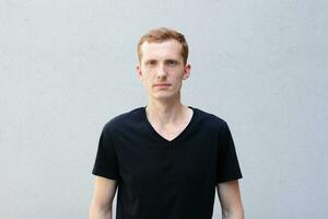 Close up portrait of a redhead of a beautiful manly guy with freckles photo