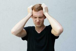 Close up portrait of a redhead of a beautiful manly guy with freckles photo