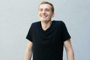 Close up portrait of a redhead of a beautiful manly guy with freckles photo