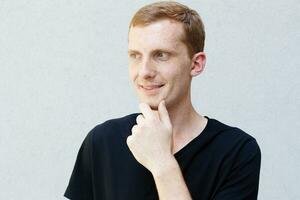 Close up portrait of a redhead of a beautiful manly guy with freckles photo