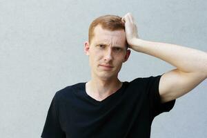 Close up portrait of a redhead of a beautiful manly guy with freckles photo