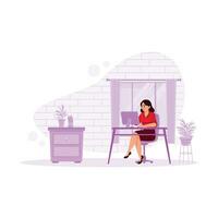 Friendly mature woman working in a modern office. He uses a computer while working in the office. Office concept. Trend Modern vector flat illustration