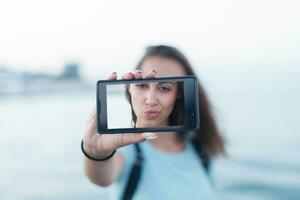 Portrait of attractive teenager girl standing photo