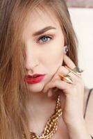 Gold earrings, ring and necklace. photo