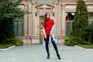 lady is rushing in the city-center turns to camera and smiles. photo