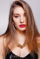 Gold earrings, ring and necklace. photo