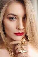 Gold earrings, ring and necklace. photo