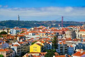 View of Lisbon from Miradouro dos Barros viewpoint with clouds. Lisbon, Portugal photo