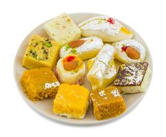 Indian Delicious Mix Sweet Food or Mix Mithai on White Background photo