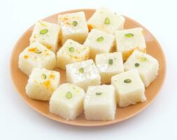 Indian Popular Sweet Food Khopara Pak or Coconut Burfi on White Background photo