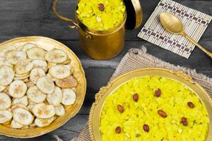 Indian Spicy And Crispy Popular Breakfast Poha Chivda on Wooden Background photo