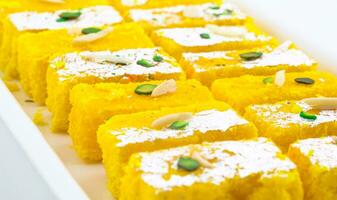 Indian Popular Sweet Food Khopara Pak or Coconut Burfi on White Background photo