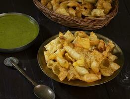 Indian Breakfast Dish Sola Fali or Masala Papri Served With Green Chutney photo