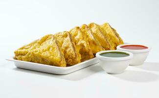 Indian Fried Snack Bread Pakora or Bread Bhaji Served with Tomato Ketchup, Green Chutney it is Made From Bread Slices photo