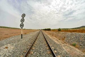 a railroad track with a sign on it photo