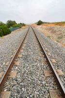 a railroad track with a sign on it photo