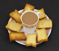 Indian Masala Chai or Morning Tea on Black Background photo