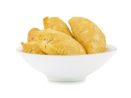 Gujiya or Gujia is a indian sweet dumpling photo