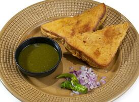 Indian Fried Snack Bread Pakora or Bread Bhaji a Common Street Food, it is Made From Bread Slices, Gram Flour, and Spices Among other Ingredients photo