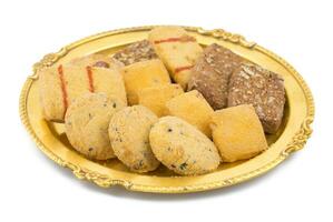 Sweet And Tasty Mixed Cookies or Biscuits Served in Golden Plate photo