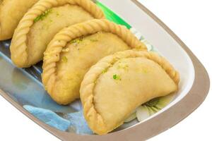 Gujiya or Gujia is a indian sweet food photo