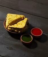 Indian Fried Snack Bread Pakora or Bread Bhaji Served with Tomato Ketchup, Green Chutney it is Made From Bread Slices photo