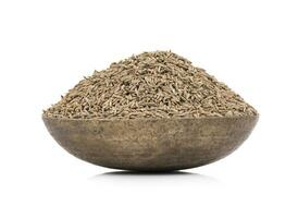 Pile of Dried Cumin Seeds on white Background photo