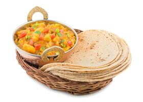 Indian Cuisine Spicy Fried Aloo Served with Indian Bread on White Background photo