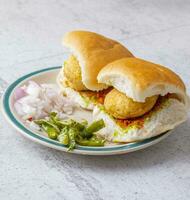 Indian Famous Street Food Vada Pav is a Vegetarian Fast Food Dish From Maharashtra photo