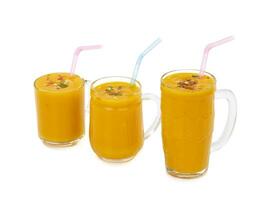 Fresh mango fruit juice on white background photo