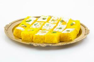 Indian Popular Sweet Food Khopara Pak or Coconut Burfi on White Background photo