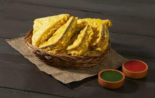 Indian Fried Snack Bread Pakora or Bread Bhaji Served with Tomato Ketchup, Green Chutney it is Made From Bread Slices photo