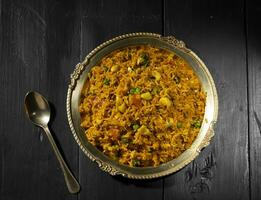 Indian Cuisine Food Kashmiri Pulao is A Delicious Rice Preparation Where Rice is Cooked in Milk and is Loaded With Dry Fruits And Vegetables photo