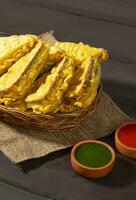 Indian Fried Snack Bread Pakora or Bread Bhaji Served with Tomato Ketchup, Green Chutney it is Made From Bread Slices photo