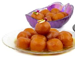 Indian Popular Dessert Gulab Jamun on White Background photo