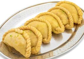 Gujiya or Gujia is a indian sweet food photo