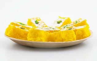 Indian Popular Sweet Food Khopara Pak or Coconut Burfi on White Background photo