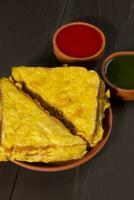 Indian Fried Snack Bread Pakora or Bread Bhaji Served with Tomato Ketchup, Green Chutney it is Made From Bread Slices photo