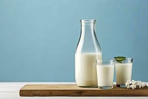 AI generated A bottle of milk and a glass of milk on a wooden table on a blue background. AI Generated photo