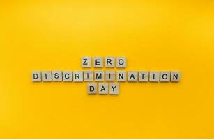 March 1, Zero Discrimination Day, a minimalistic banner with an inscription in wooden letters photo