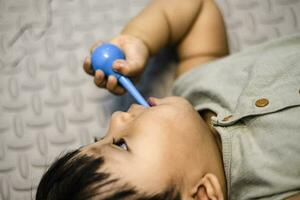 little baby practicing brushing teeth on his own. Kid brushes teeth. Oral hygiene photo