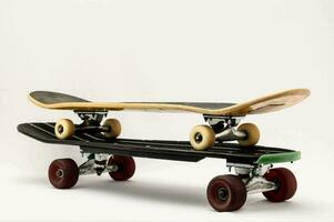 a skateboard with wheels on top of it photo