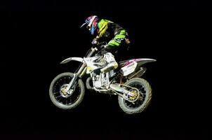 a person on a dirt bike in the air photo