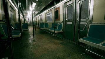 An empty subway car with blue seats and railings in the metro underground video