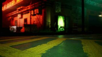 A green and yellow crosswalk in front of a building video