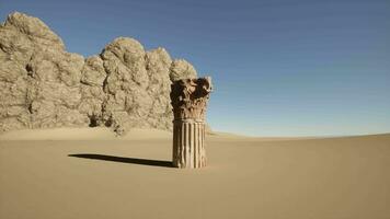 A stone pillar in the middle of a desert video